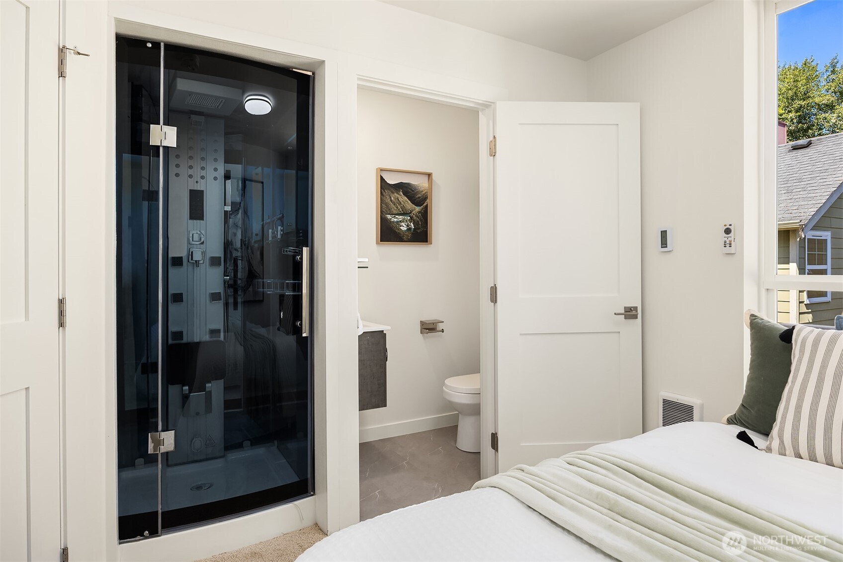 1402 North 95th Street Seattle, WA 98103 - Photo 15 of 31 a bathroom with a shower and a toilet