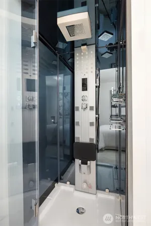 a bathroom with a shower toilet and sink