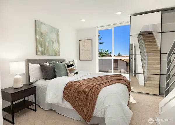 a bedroom with bed and window