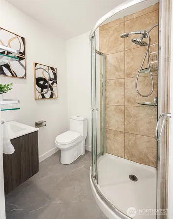 a bathroom with a shower a toilet and a shower