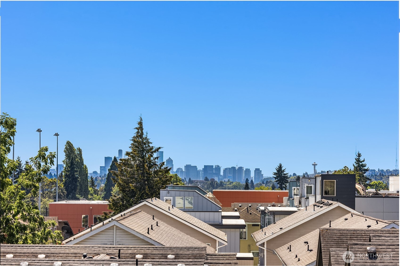 1402 North 95th Street Seattle, WA 98103 - Photo 28 of 31 a view of a white house with a yard and wooden fence
