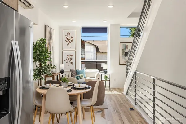 a view of a dining room with furniture window and wooden floor