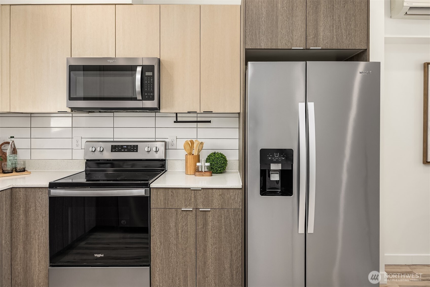 1402 North 95th Street Seattle, WA 98103 - Photo 9 of 31 a kitchen with stainless steel appliances a refrigerator stove and microwave