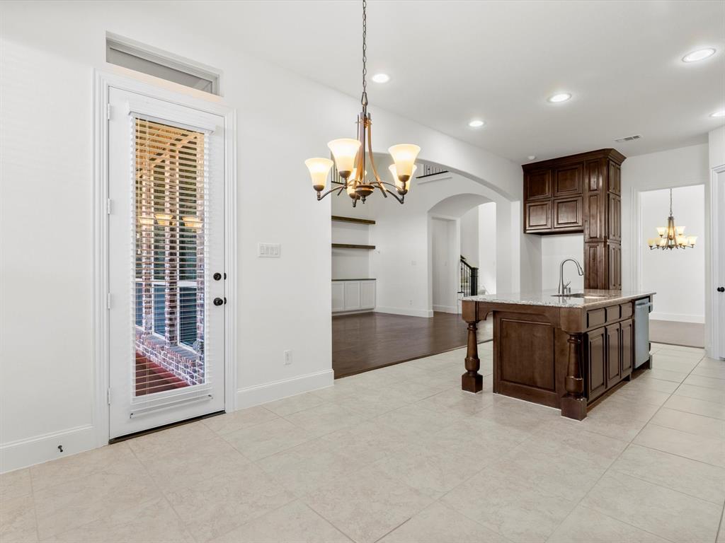 13192 Mapleton Drive Frisco, TX 75035 - Photo 13 of 40 a view of a living room and a chandelier