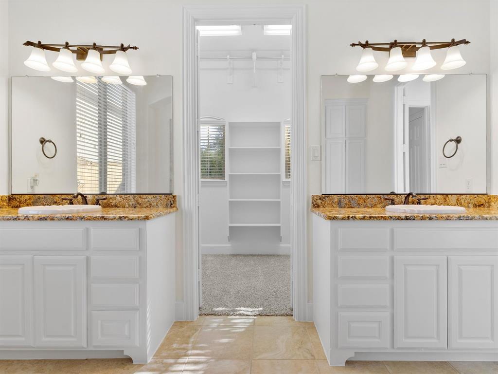 13192 Mapleton Drive Frisco, TX 75035 - Photo 22 of 40 a bathroom with a sink and a mirror