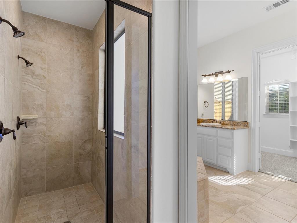 13192 Mapleton Drive Frisco, TX 75035 - Photo 23 of 40 a view of a bathroom from a hallway