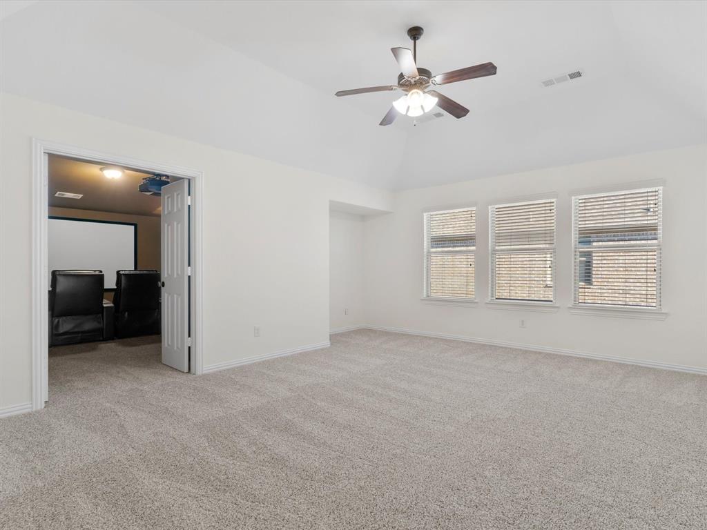 13192 Mapleton Drive Frisco, TX 75035 - Photo 27 of 40 a view of an empty room with a ceiling fan