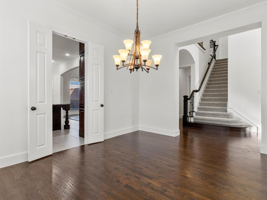 13192 Mapleton Drive Frisco, TX 75035 - Photo 8 of 40 a view of a room with wooden floor and stairs