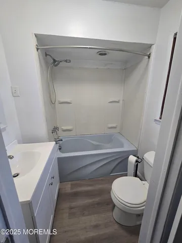 a bathroom with a sink a toilet and a bathtub
