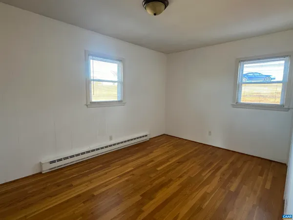 a bathroom with a sink mirror toilet and shower
