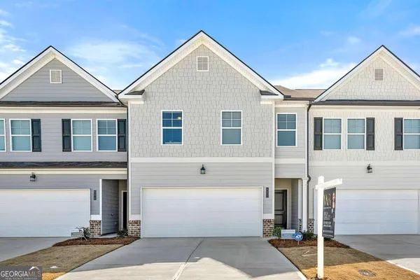 a front view of a house with a garage