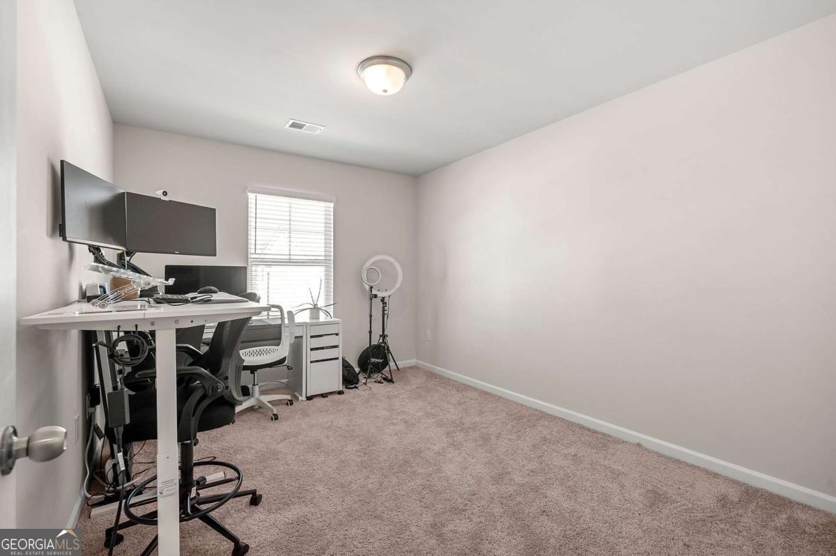 6372 Rosetta Drive Atlanta, GA 30331 - Photo 13 of 26 a view of a workspace with furniture and a window