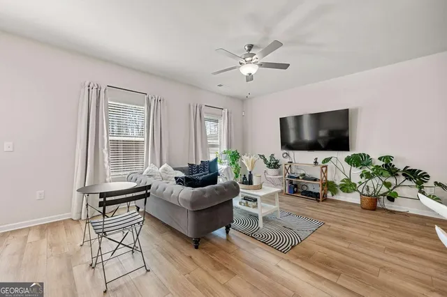 a living room with furniture fireplace and a flat screen tv