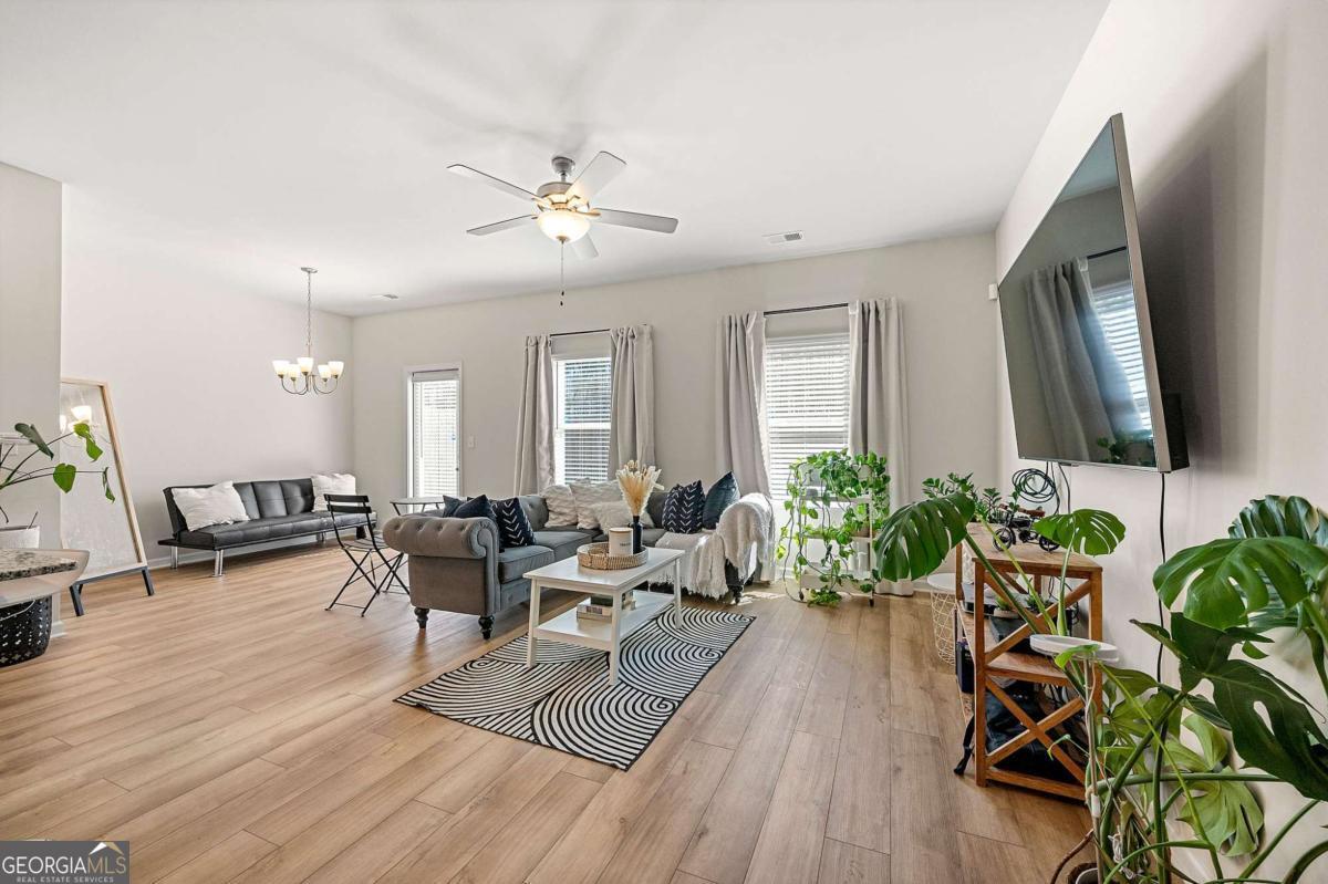 6372 Rosetta Drive Atlanta, GA 30331 - Photo 4 of 26 a living room with furniture and a wooden floor