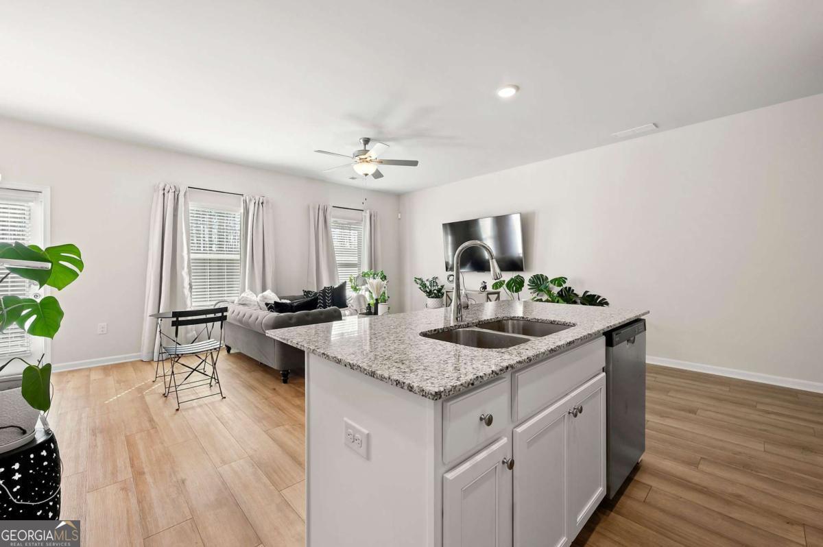 6372 Rosetta Drive Atlanta, GA 30331 - Photo 8 of 26 a kitchen with sink and mirror