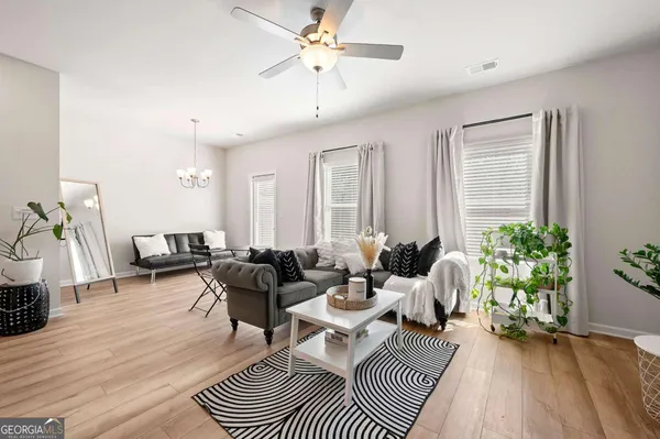 a living room with furniture and a large window