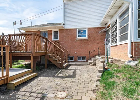 a view of a house with wooden deck