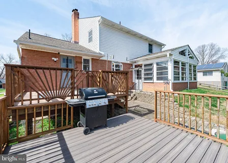 a view of balcony with wooden floor and fence