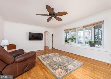 a living room with a couch and a rug