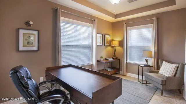 a spacious bedroom with a bed and a couch