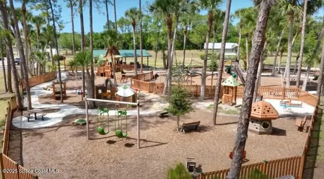 a store with outdoor seating area and blue umbrellas
