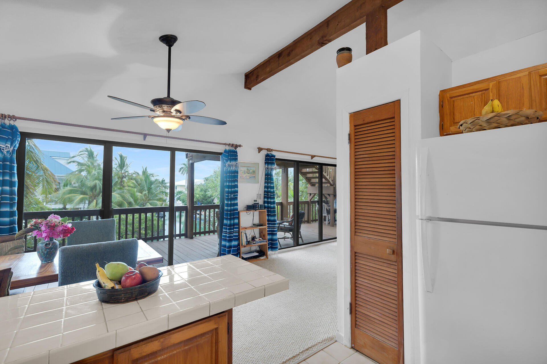 683 Blackbeard Road Summerland Key, FL 33042 - Photo 17 of 49 a kitchen view living space with furniture and garden view