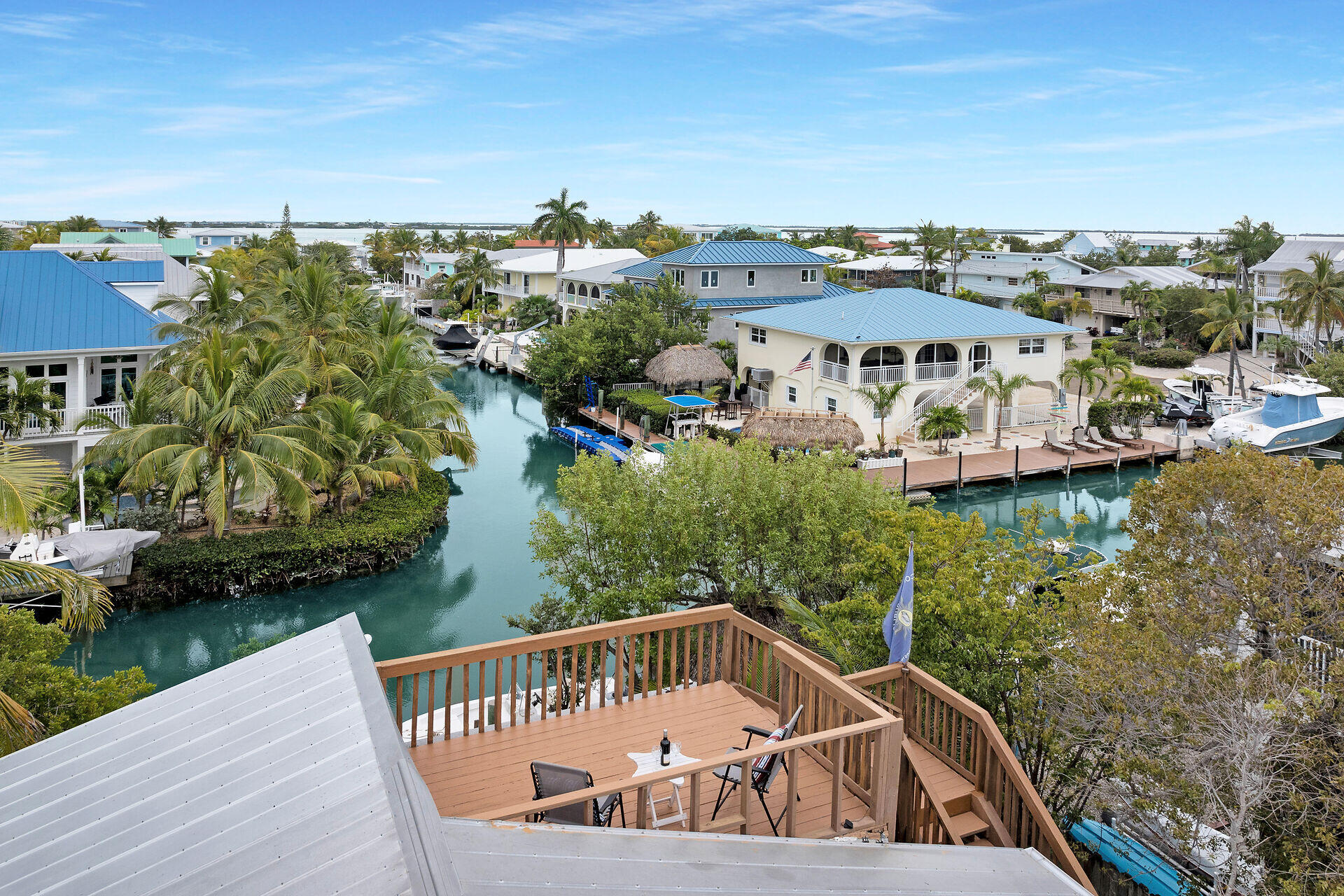 683 Blackbeard Road Summerland Key, FL 33042 - Photo 31 of 49 a view of a balcony with two chairs and a yard