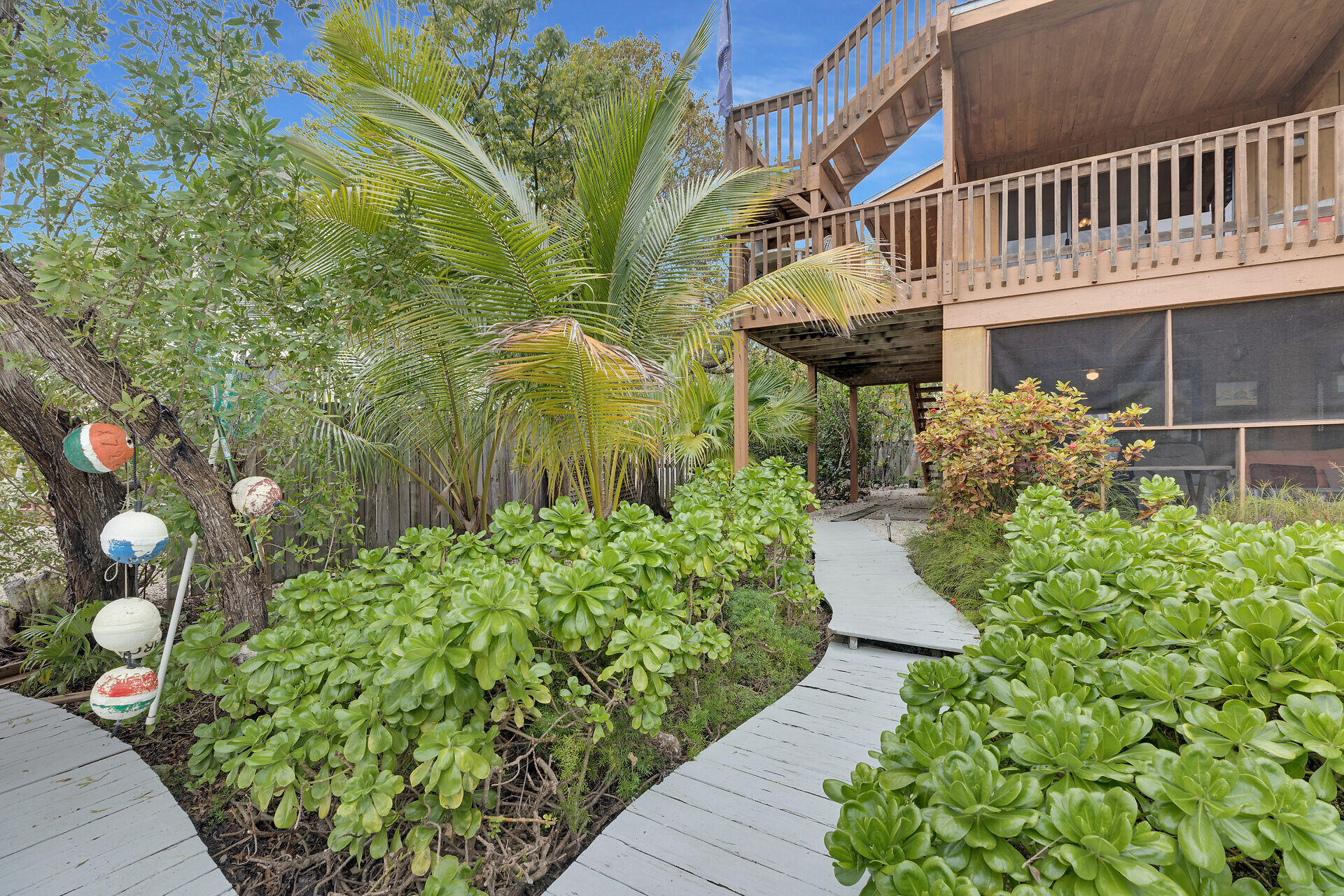 683 Blackbeard Road Summerland Key, FL 33042 - Photo 7 of 49 a front view of a house with a yard