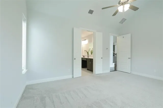 an empty room with a bathroom and a bathroom sink