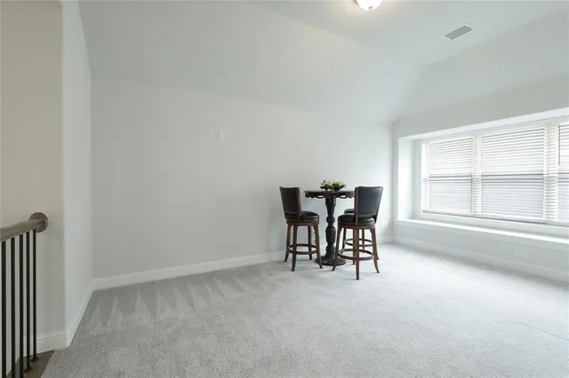a view of a livingroom with furniture and a window
