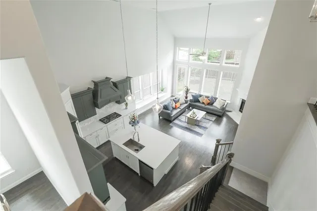 a view of a dining room with furniture wooden floor and chandelier