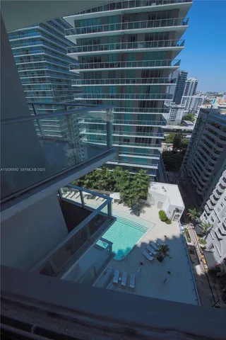 a view of swimming pool from a balcony