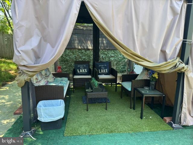 4603 Raleigh Road Temple Hills, MD 20748 - Photo 20 of 40 a view of an chairs and table in patio next to a yard