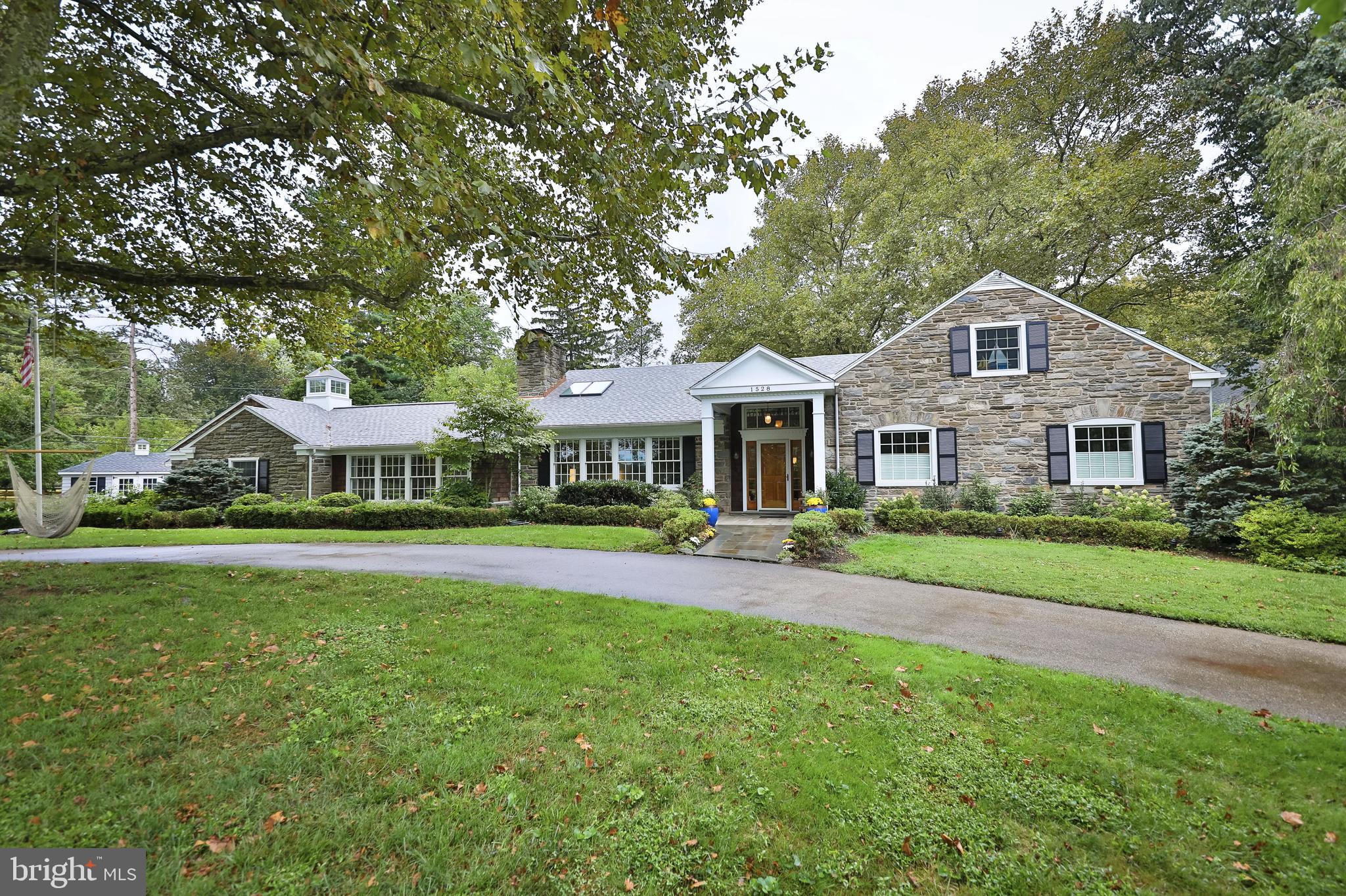 Expanded Cape w/ Stone Exterior sited on .88 Acres