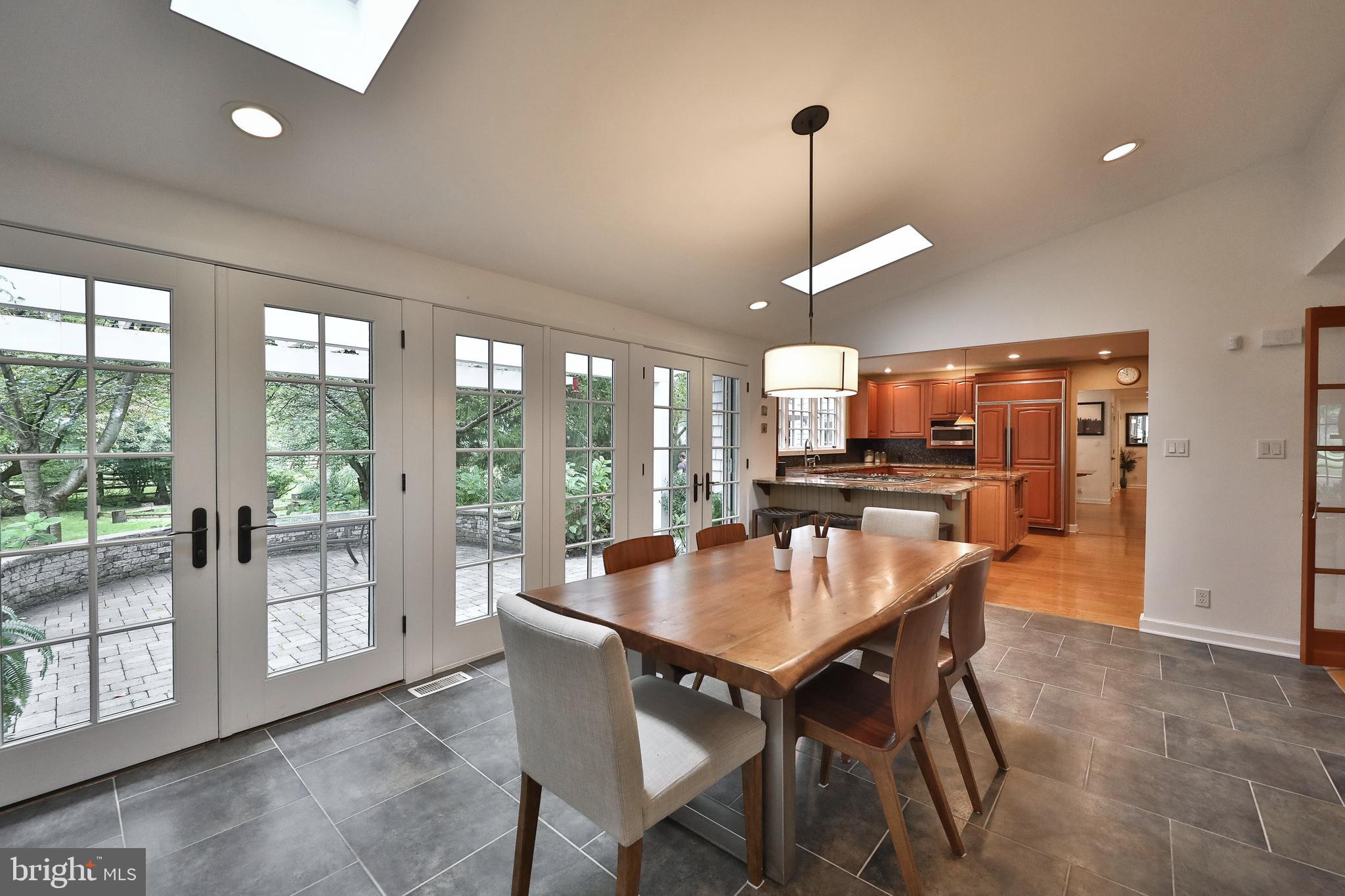 1528 Spring Mill Road Gladwyne, PA 19035 - Photo 20 of 48 French doors leading to expansive paver patio