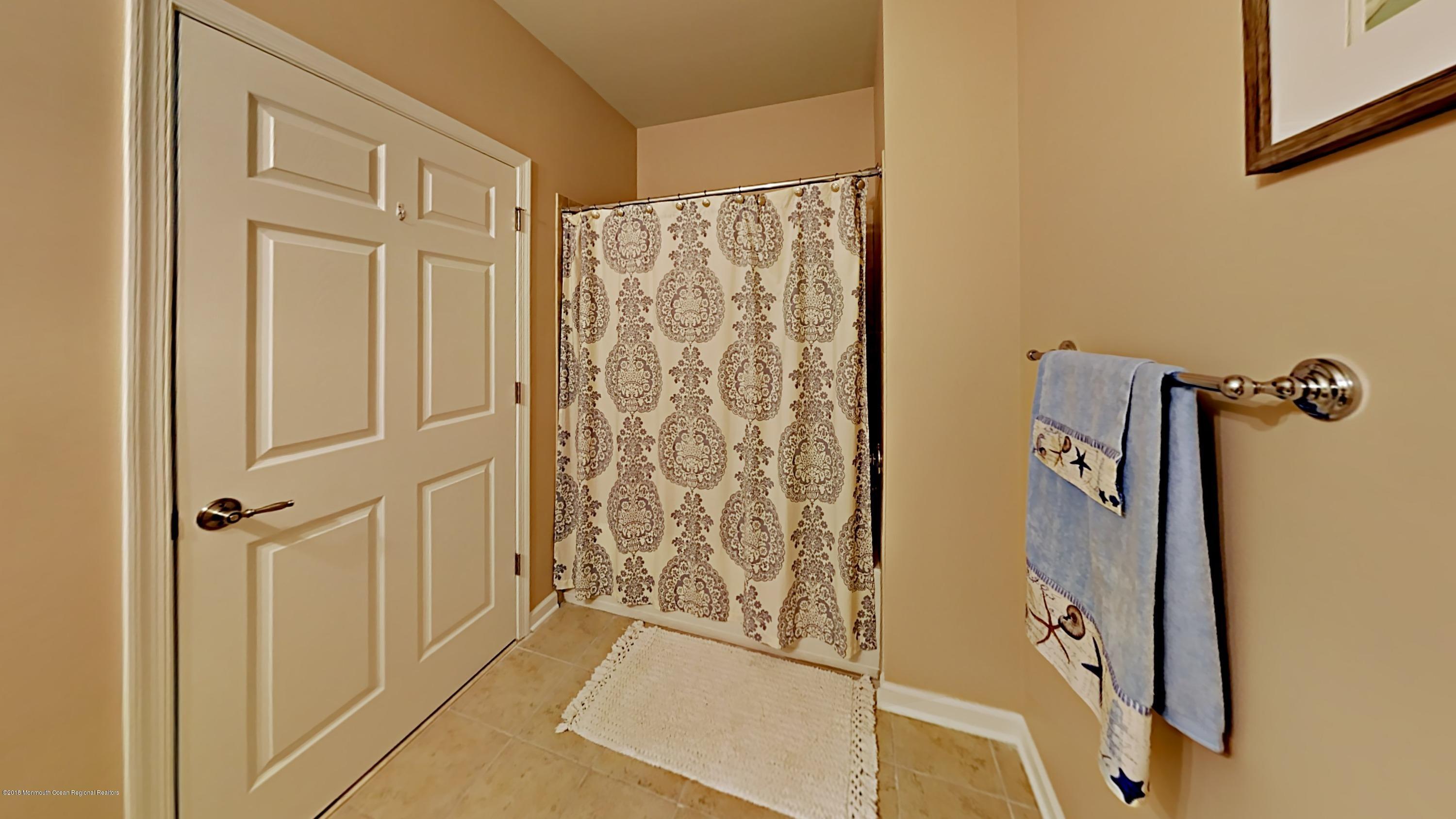 2201 River Road, Unit 4307 Point Pleasant, NJ 08742 - Photo 19 of 21 a bathroom with a shower