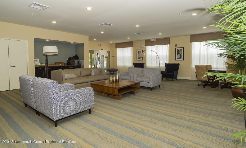 2201 River Road, Unit 4307 Point Pleasant, NJ 08742 - Photo 21 of 21 a living room with furniture and a wooden floor