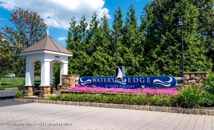 2201 River Road, Unit 4307 Point Pleasant, NJ 08742 - Photo 3 of 21 a view of sign board with flower plants