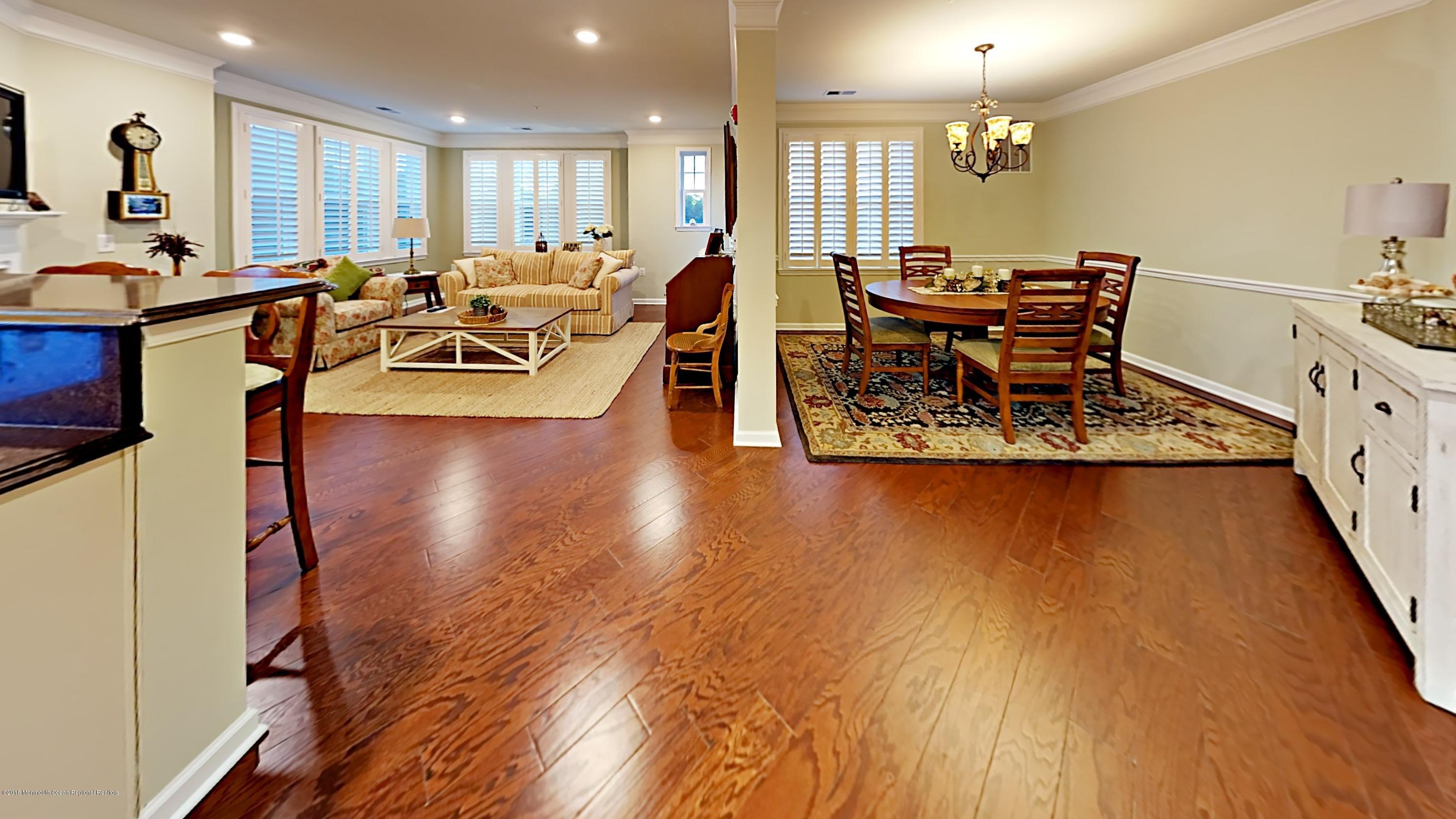 2201 River Road, Unit 4307 Point Pleasant, NJ 08742 - Photo 8 of 21 a view of a dining room with furniture window and wooden floor