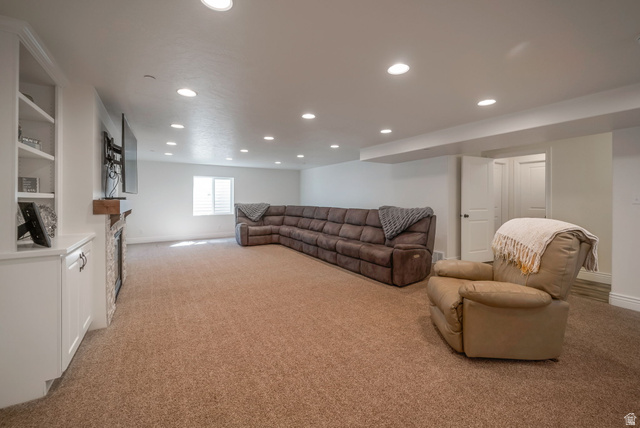 1288 North Horizon View Loop Elk Ridge, UT 84651 - Photo 29 of 40 Living room featuring recessed lighting, light carpet, and a fireplace