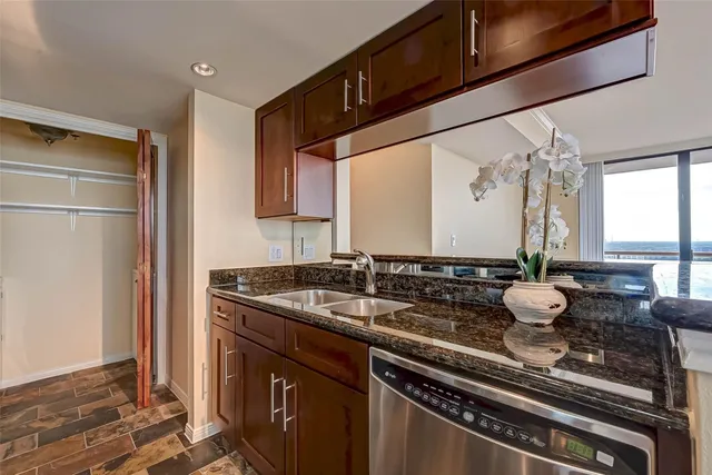 a kitchen with a stove microwave and cabinets