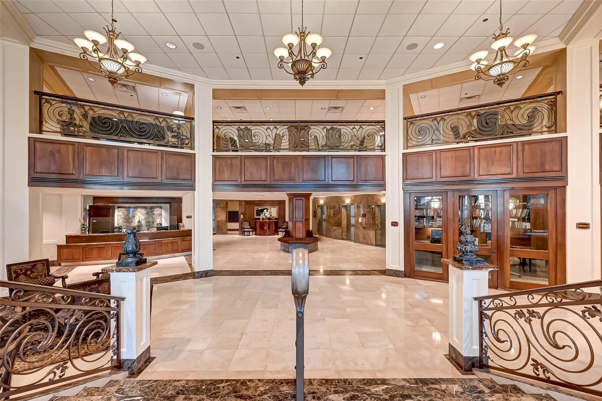 3525 Sage Road, Unit 1703 Houston, TX 77056 - Photo 6 of 43 a view of a dining room with furniture a chandelier and chandelier