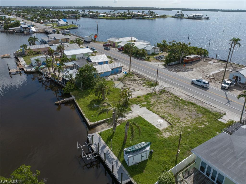 4850 Pine Island Road Bokeelia, FL 33922 - Photo 11 of 24 an aerial view of a house with a lake view