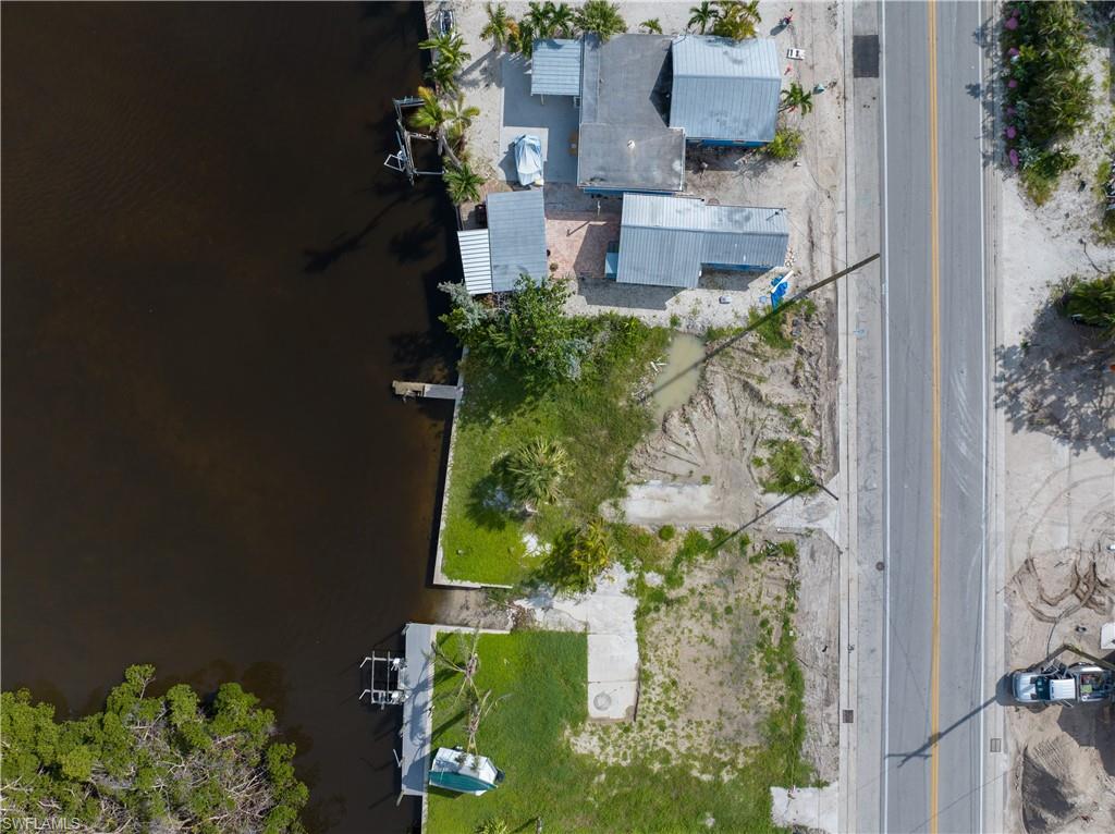 4850 Pine Island Road Bokeelia, FL 33922 - Photo 13 of 24 an aerial view of residential houses with outdoor space