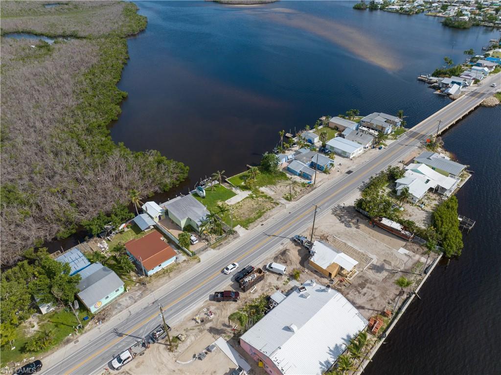 4850 Pine Island Road Bokeelia, FL 33922 - Photo 14 of 24 an aerial view of a house with a yard