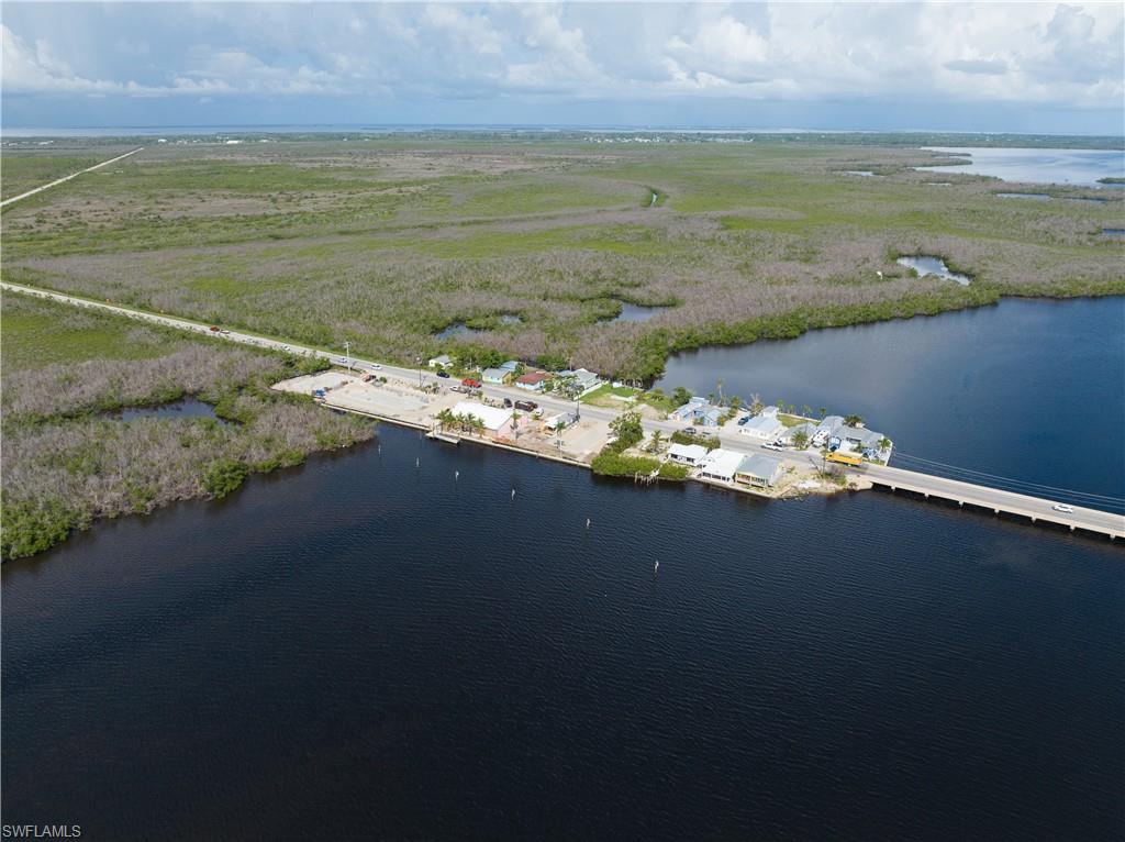 4850 Pine Island Road Bokeelia, FL 33922 - Photo 20 of 24 a view of an ocean and beach