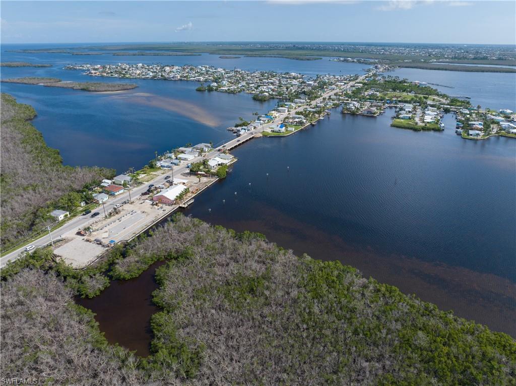 4850 Pine Island Road Bokeelia, FL 33922 - Photo 21 of 24 an aerial view of a houses with ocean view