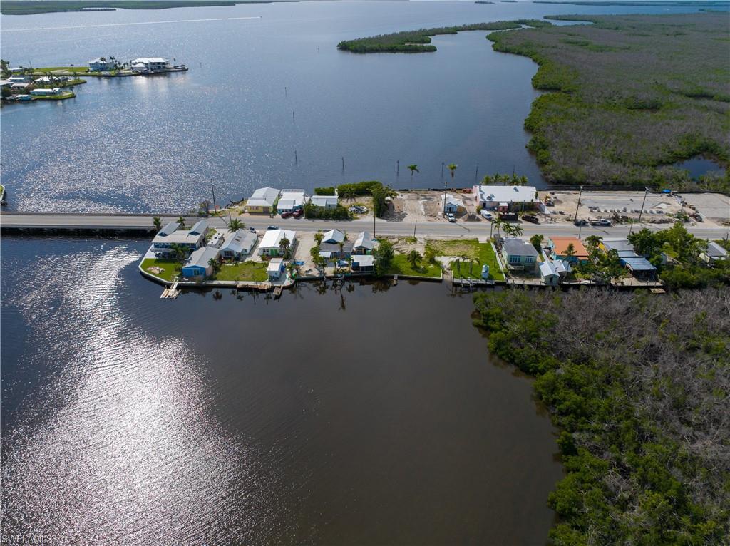 4850 Pine Island Road Bokeelia, FL 33922 - Photo 23 of 24 a view of swimming pool from a lake view