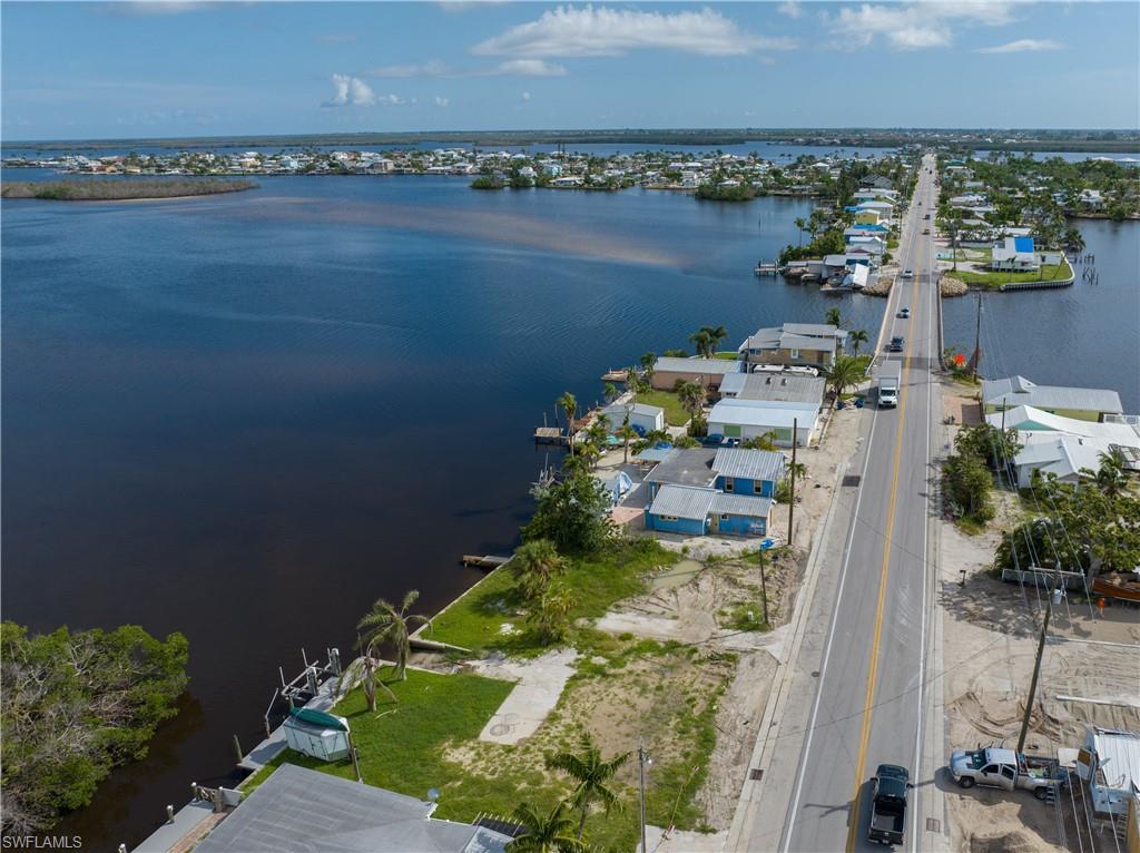 4850 Pine Island Road Bokeelia, FL 33922 - Photo 9 of 24 a view of a lake with a city