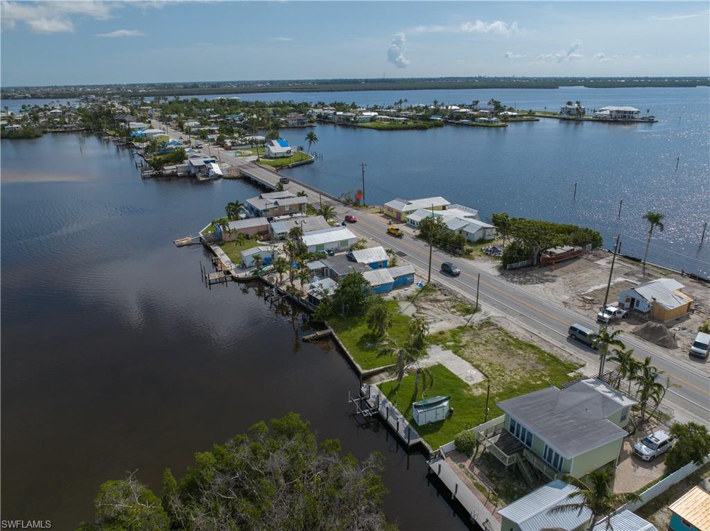 4850 Pine Island Road Bokeelia, FL 33922 - Photo 10 of 24 an aerial view of a house with outdoor space